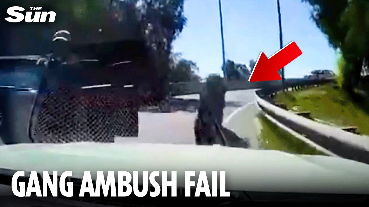 Armed gang AMBUSH car on busy motorway - but clever driver refuses to stop