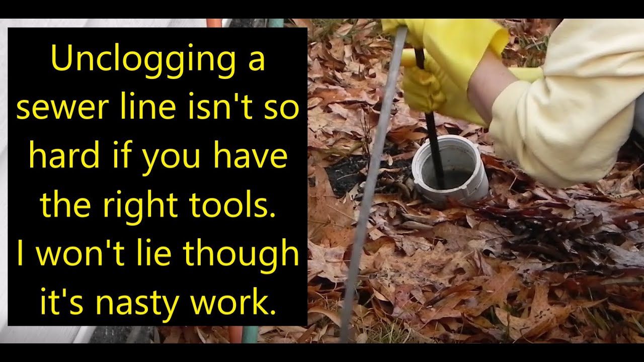 Unclogging Main Sewer Line With Hand Snake