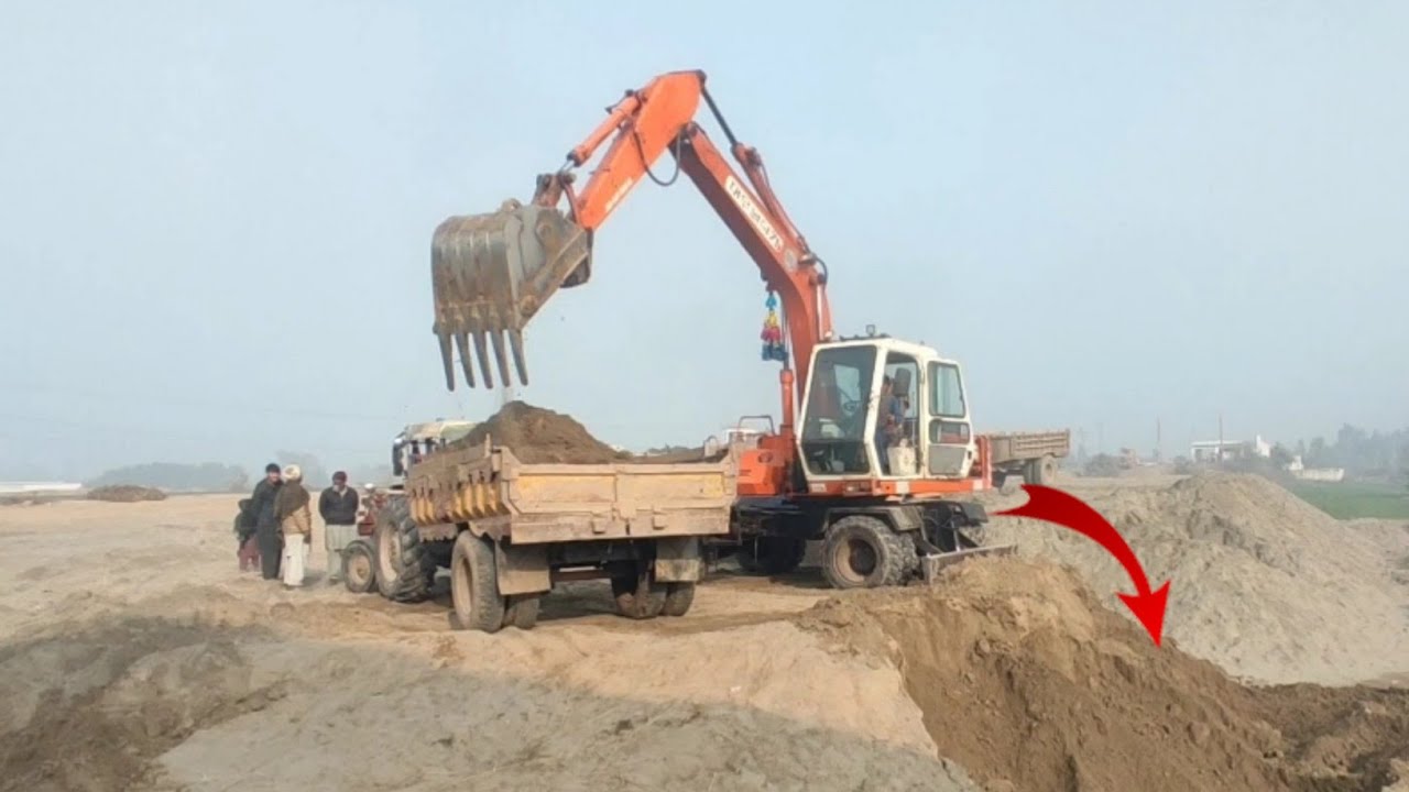 Caterpillar Excavator Loading Overburden truck 