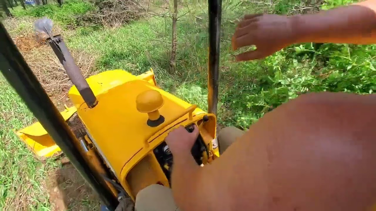 Pushing over trees with restored 1970  John Deere 350 Dozer