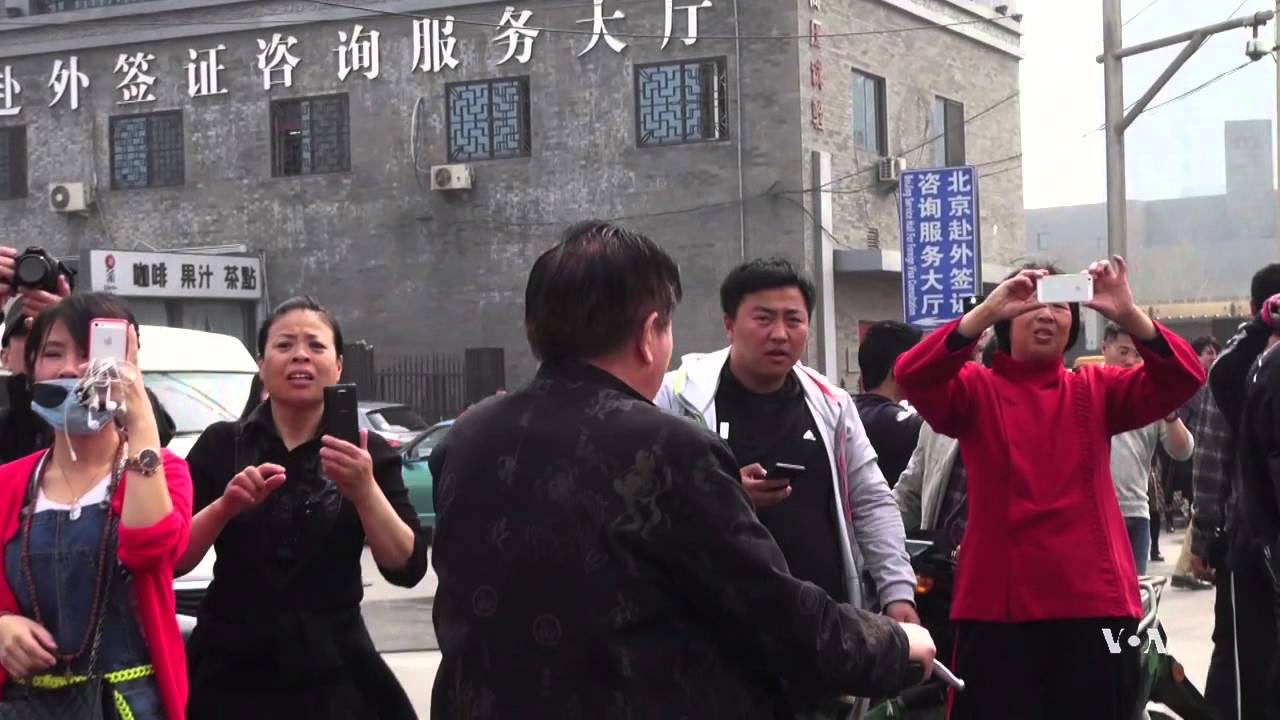 Chinese Families of MH370 Passengers Stage Street Protest