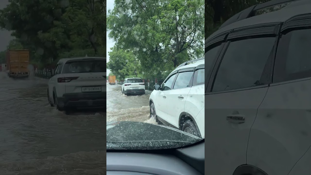 Flooding on the streets of Noida! Is it safe to take an electric car out in this much rain? 🌧️