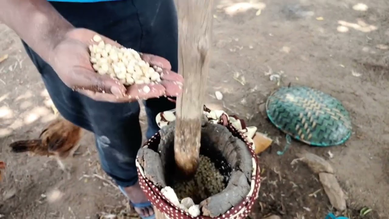 PREPARING MUTHOKOI ( DEHULLED MAIZE) AT KITUI