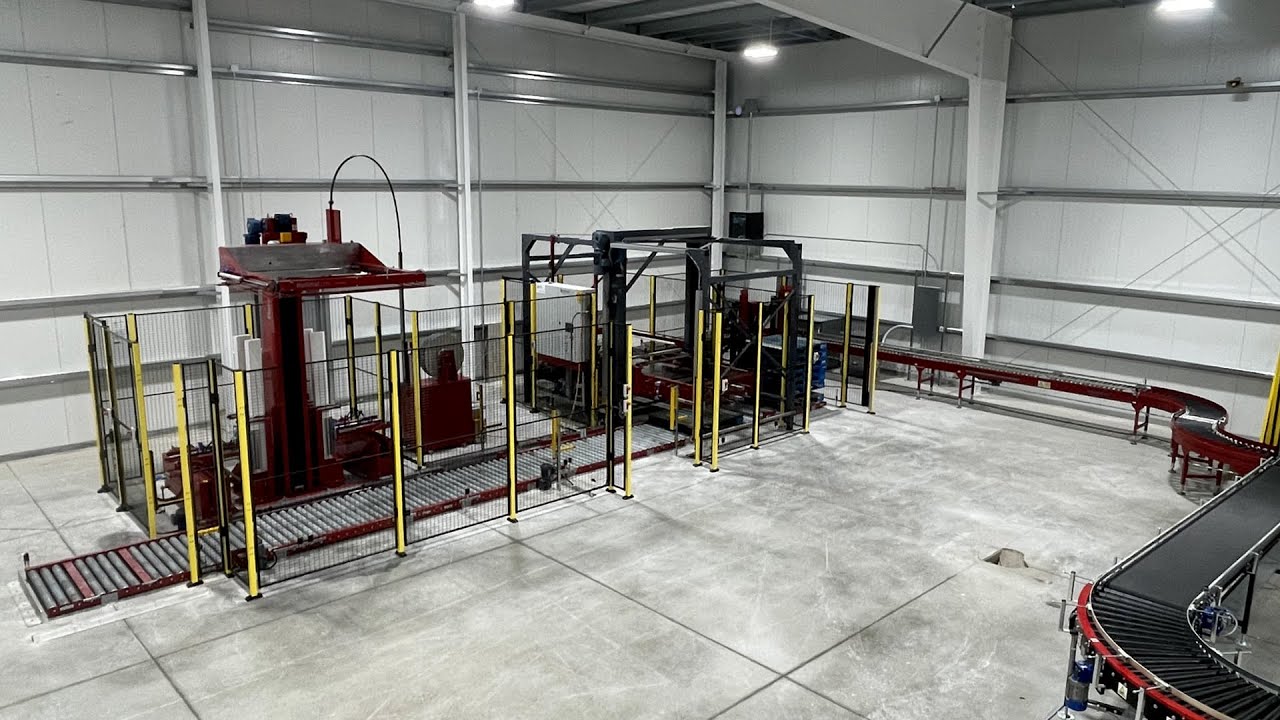 Fully automated palletizing and strapping system delivered and installed for a customer in Canada