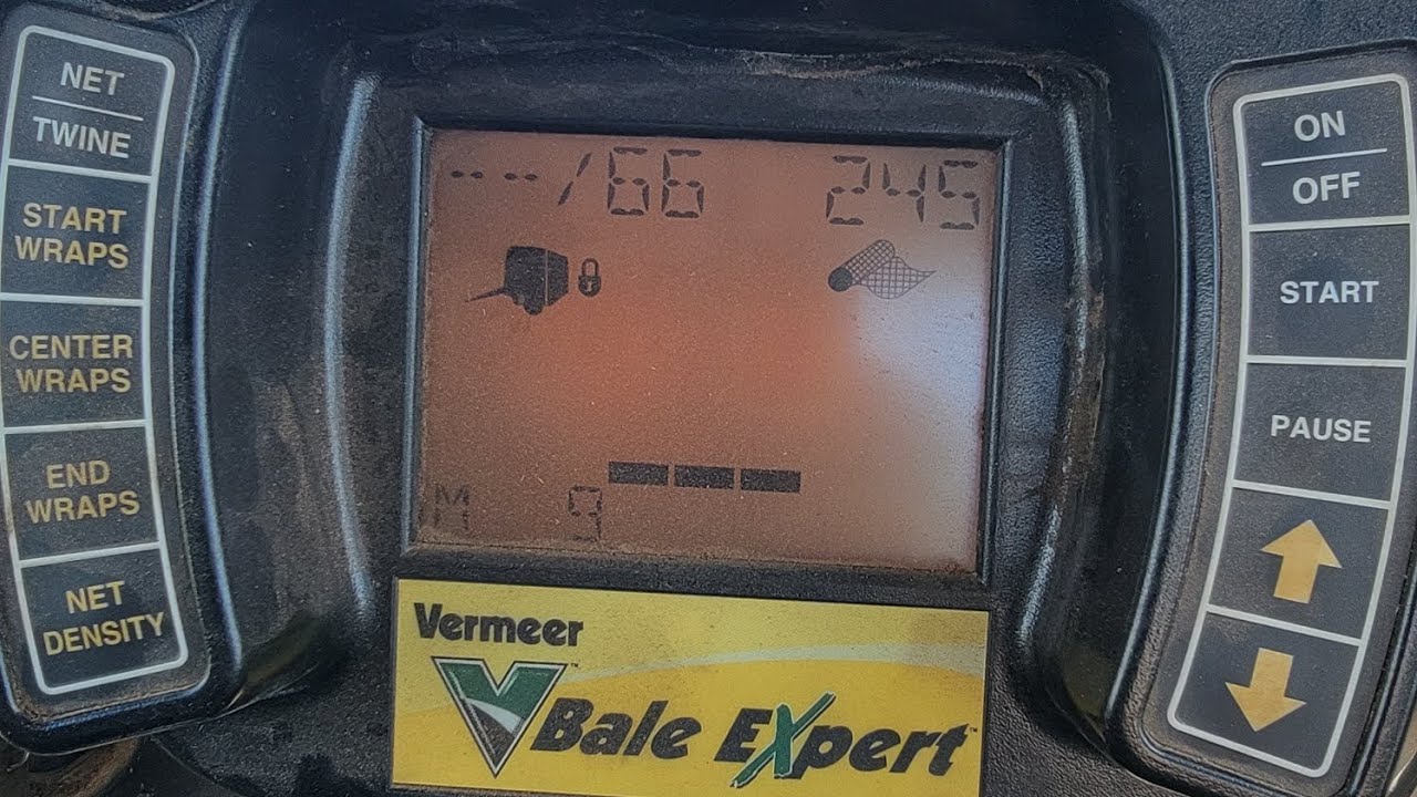 Case IH Magnum baling hay with a Vermeer 605 Super M