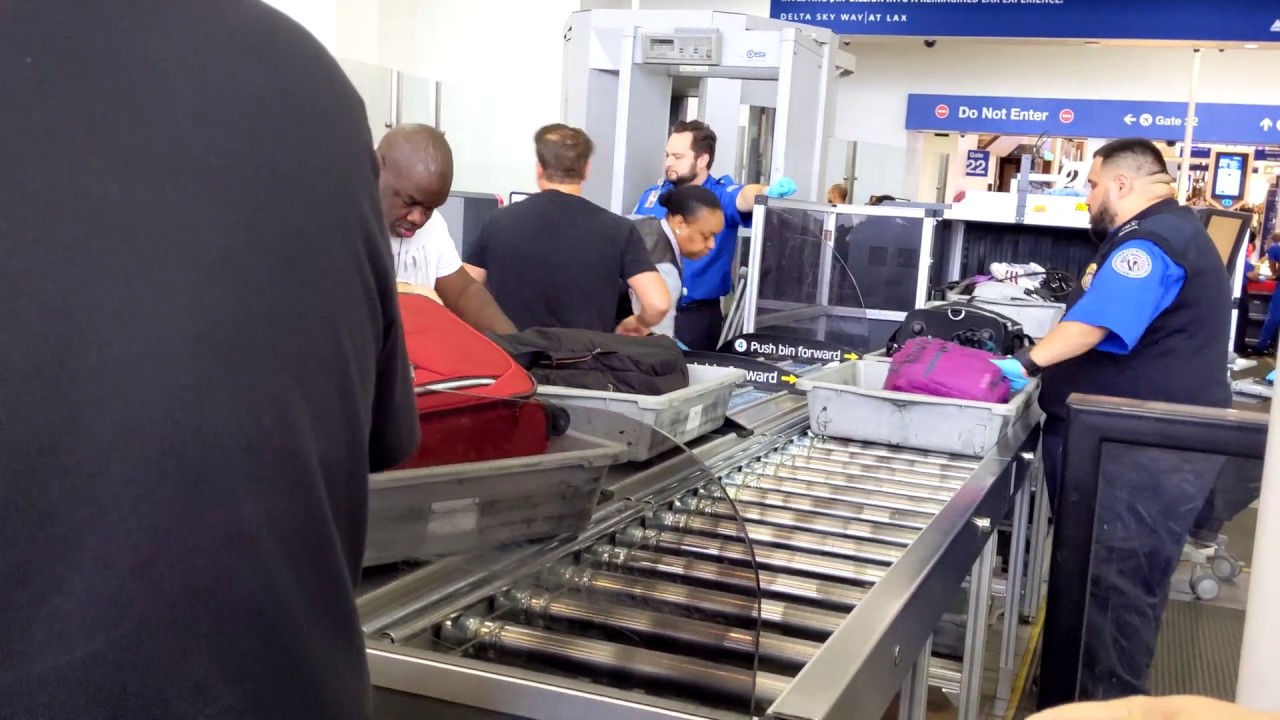 Going through TSA security check point // Security Screening at LAX Airport
