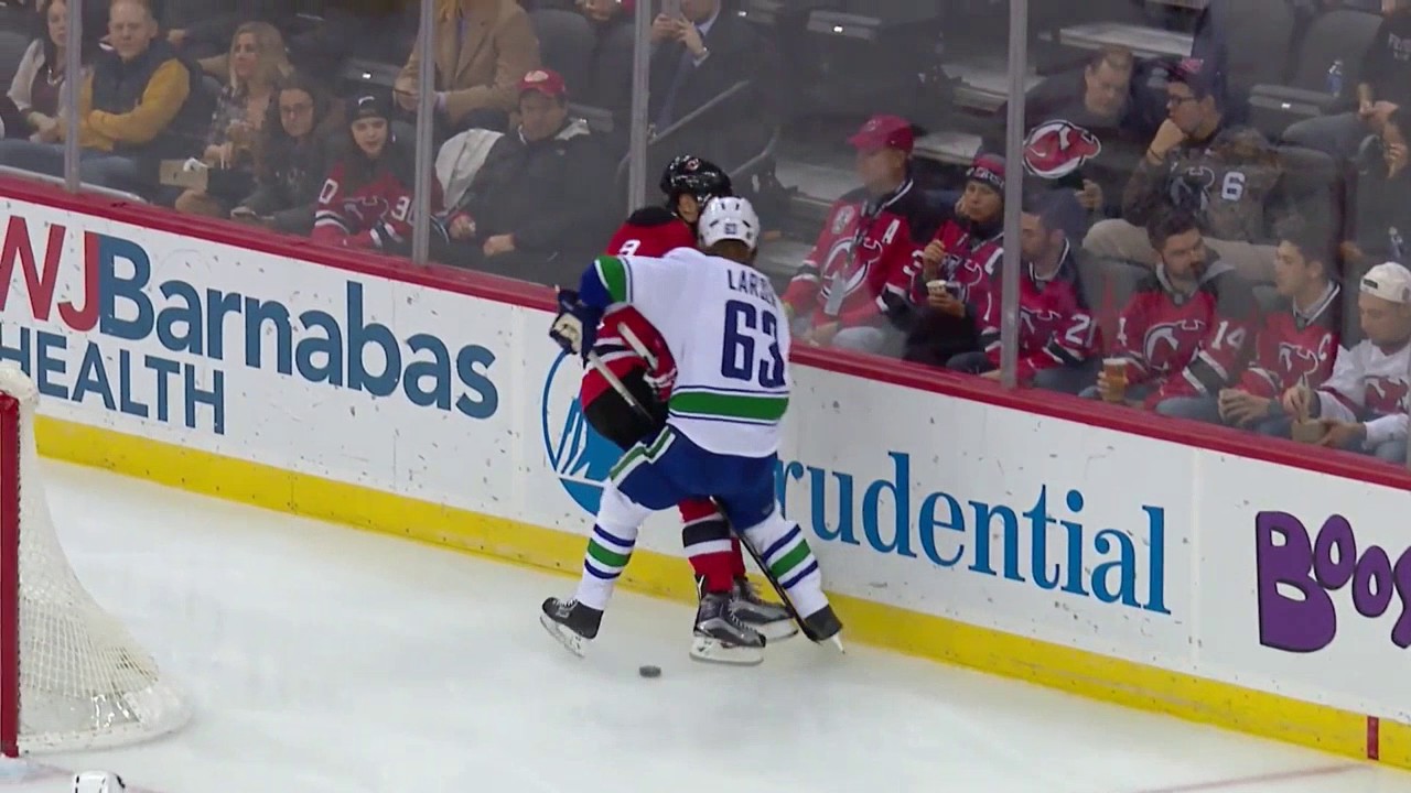 Taylor Hall lays a crushing hit on Philip Larsen