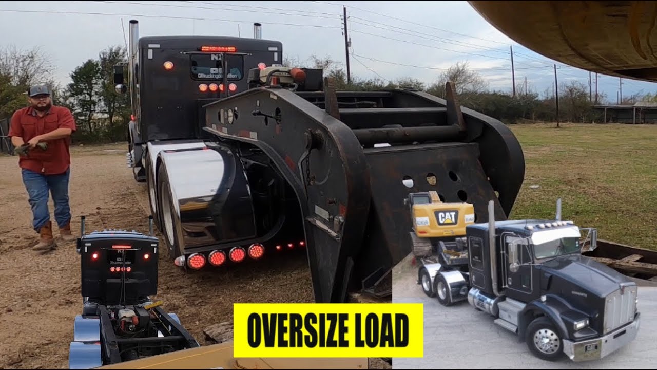 Heavy haul trucker, kenworth moving oversize excavator with RGN lowboy