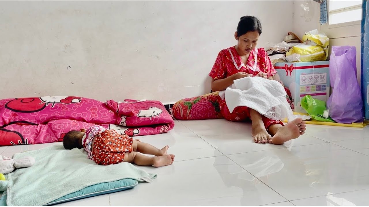 A woman takes care of two children at home and will do a little work to earn money at home.