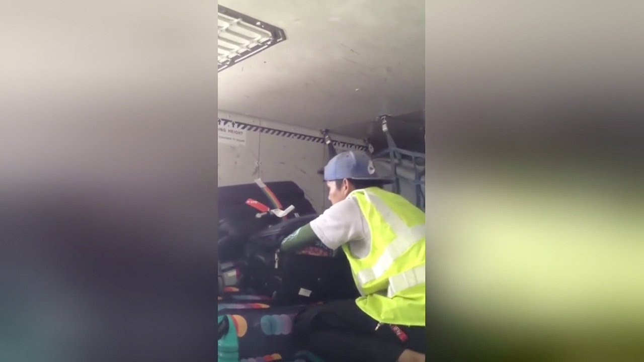Baggage handler caught stealing from luggage in Thailand