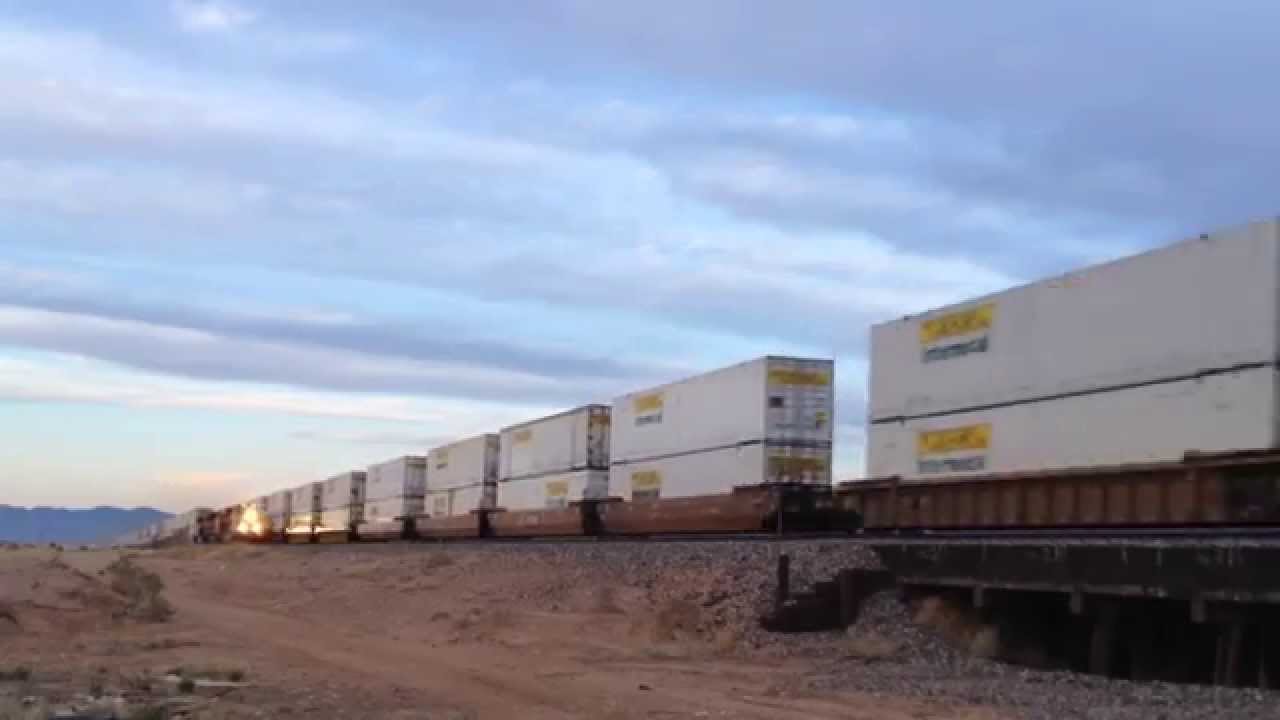 2 Very fast BNSF trains meet in front of me.