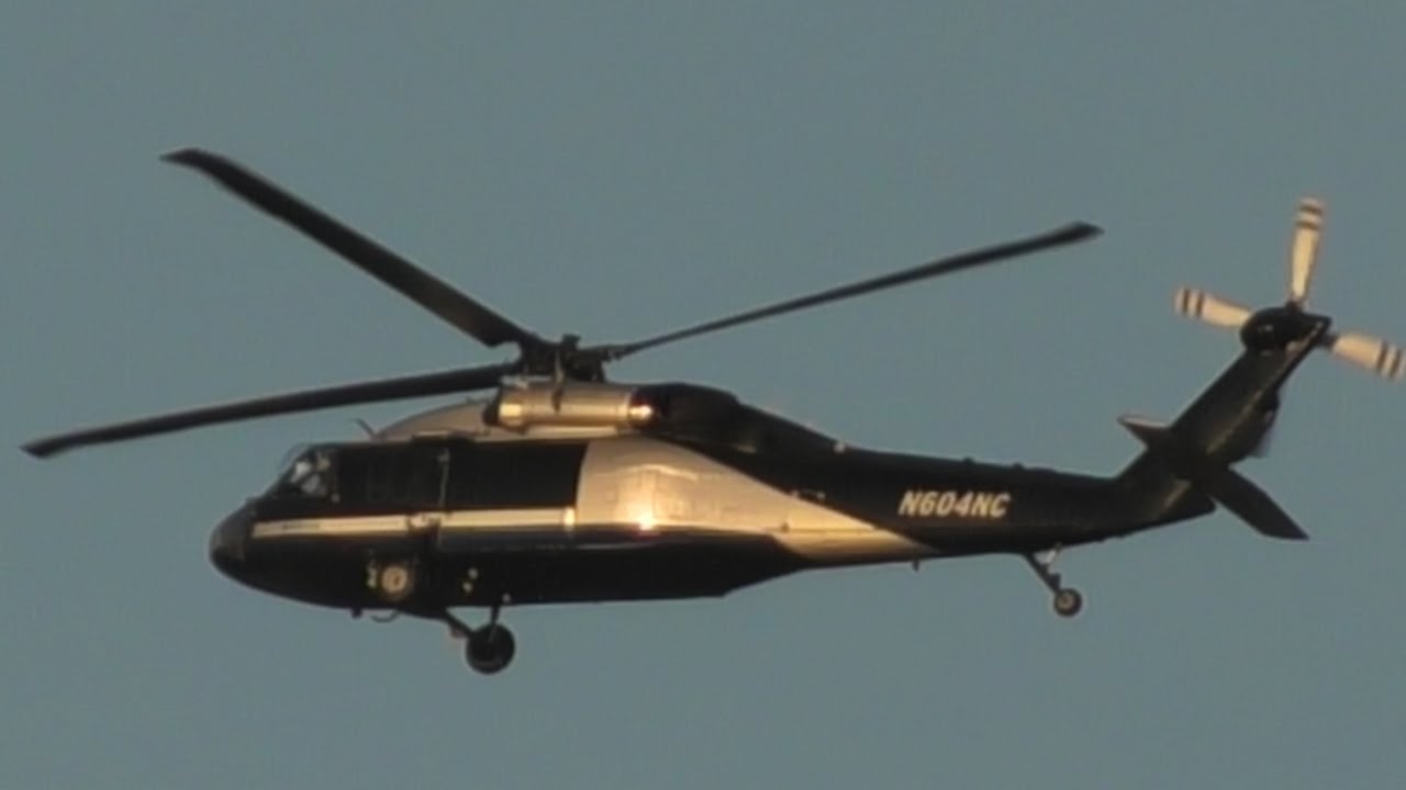 4 minutes of Two UH-60 helicopters flying around McClellan golden hour