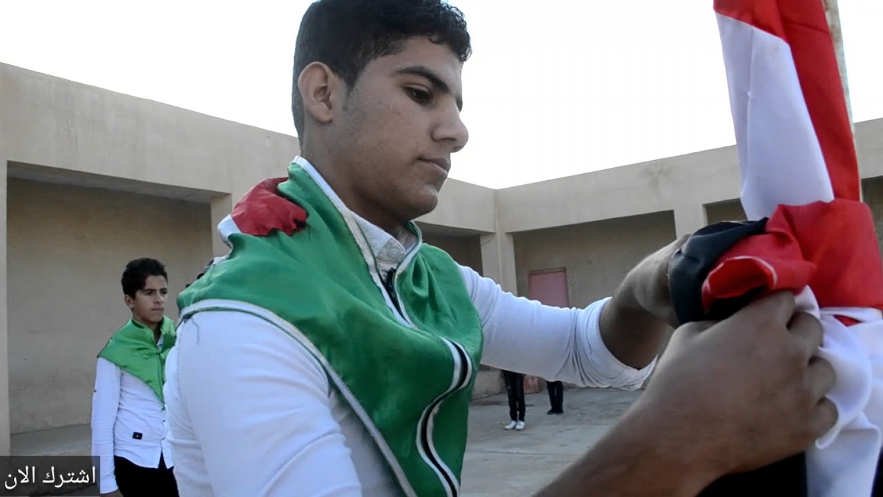 النشيد لوطني مع رفع العلم العراقي