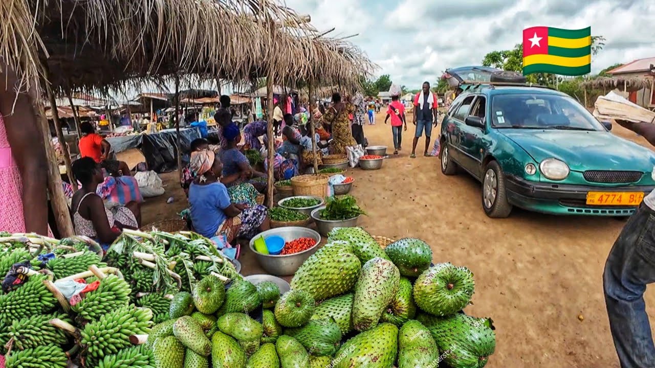 Rural market day in Assahoun village . Cheapest mass food market in Togo west Africa 🌍