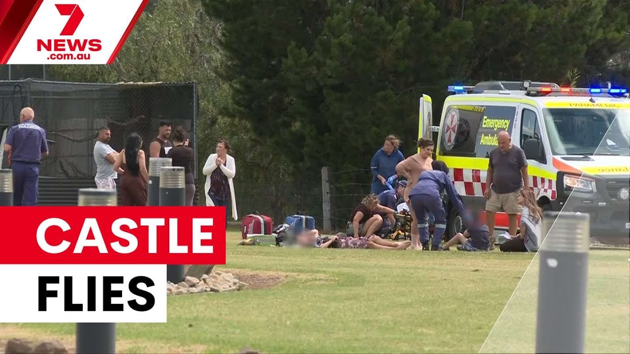 Children hospitalised as winds send jumping castle airborne | 7NEWS