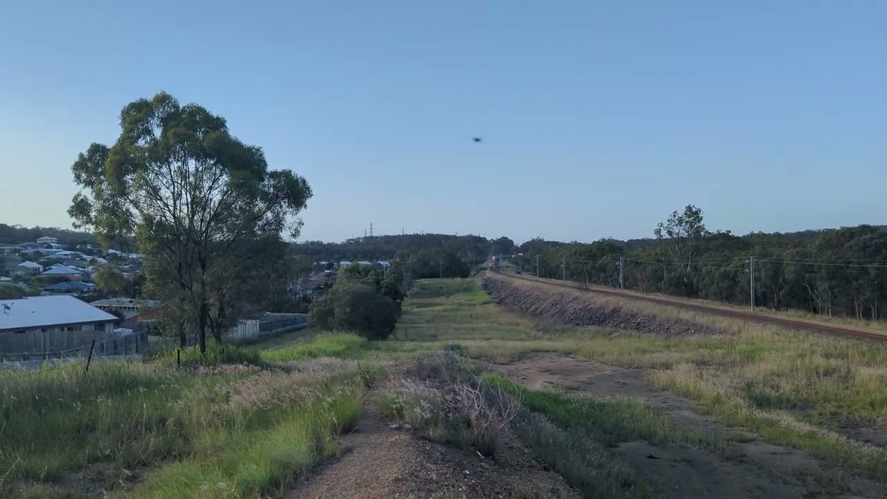 Aurizon 2831 waits in the loop for the Northbound tilt train on it soundboard Linfox intermodal run 