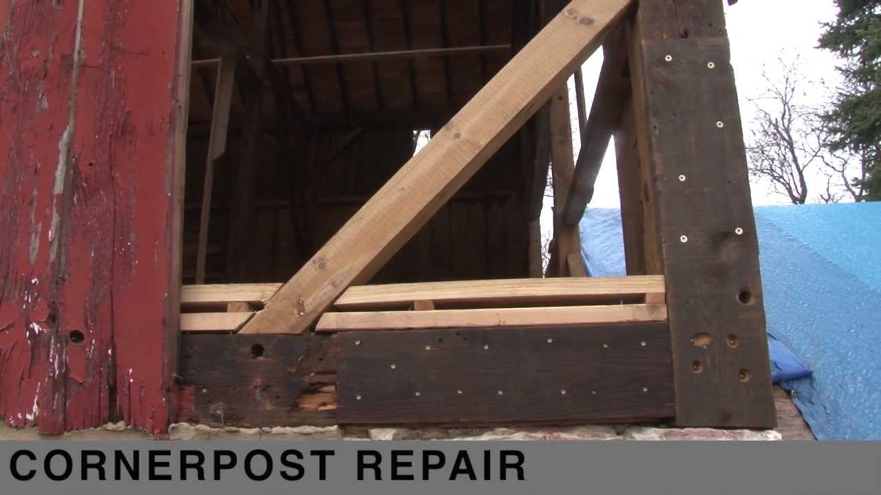Corner post repair on a timber frame barn