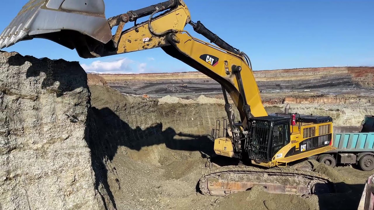 Caterpillar 385C Excavator Loading Mercedes & MAN Trucks - Interkat SA