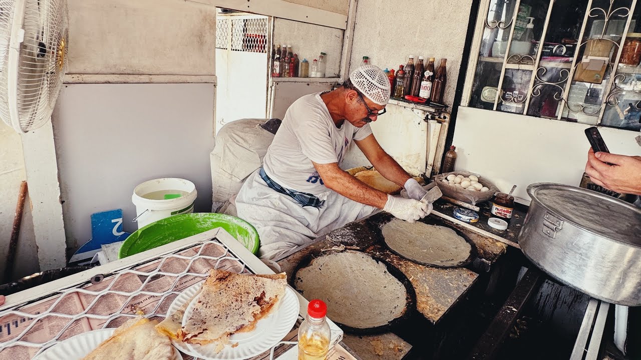 Have you ever had ragag bread? 🫓🤷🏽&zwj;♂️ This one has egg, cheese, and fish sauce 😋
