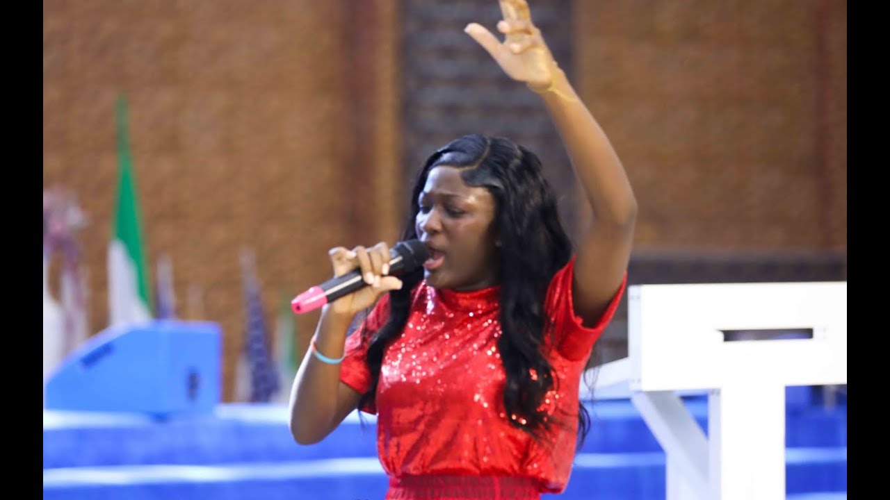MIN. DIVINE JOHNSON SULEMAN IN AN INTENSE WORSHIP MOMENT