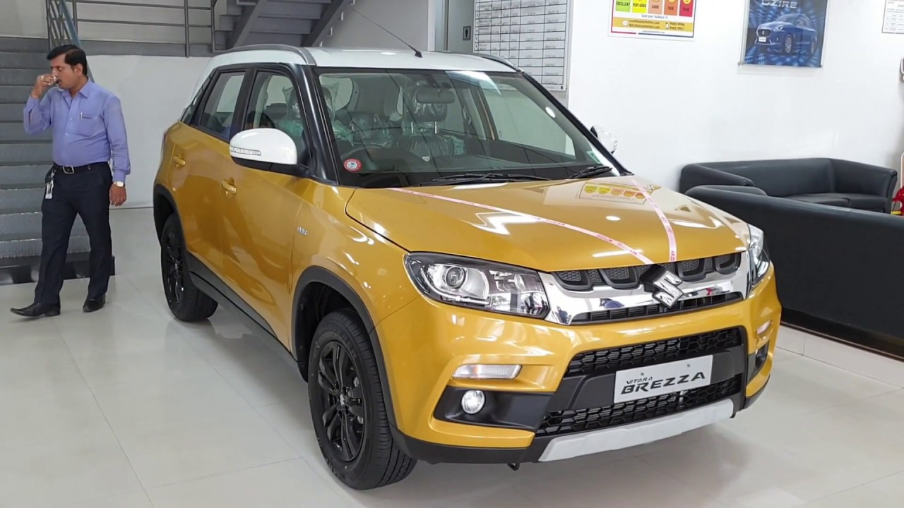 Maruti Suzuki Vitara Brezza Fiery Yellow with Pearl Arctic White|Dual Tone|Exterior&Interior