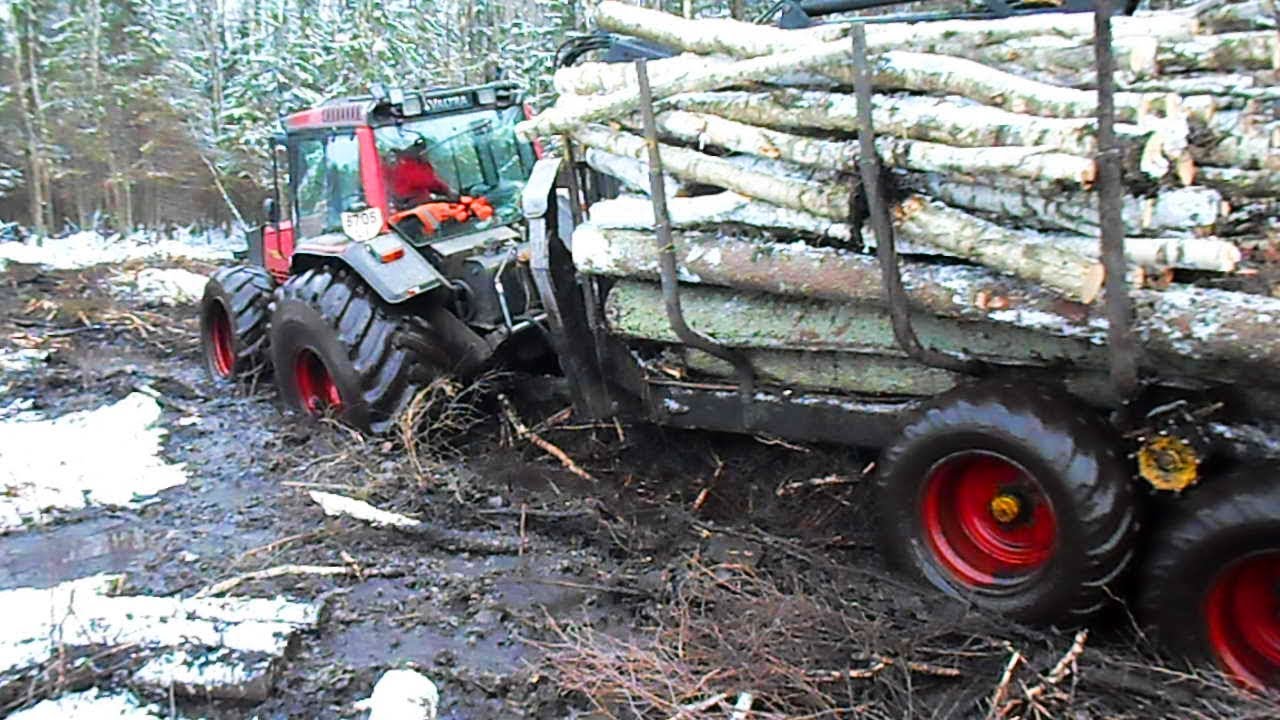 Logging in wet winter forest with Valtra forestry tractor and Kronos trailer