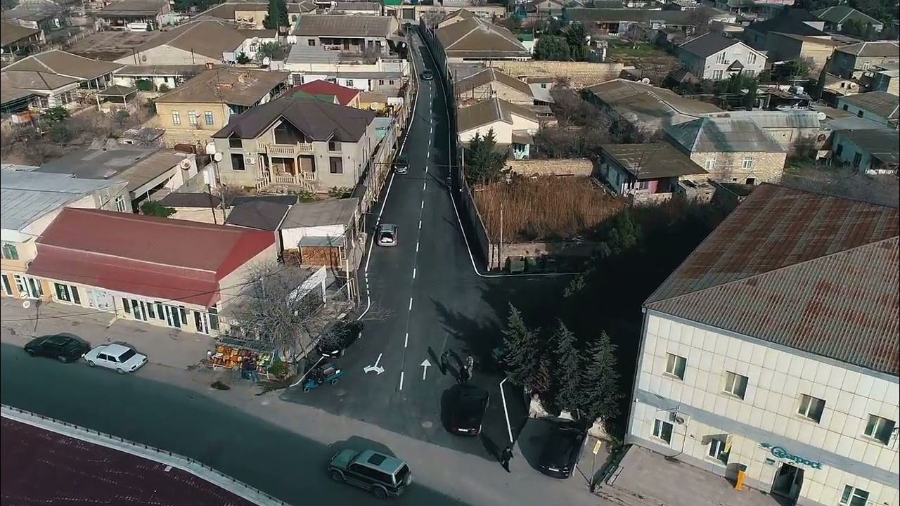 Maştağa qəsəbəsində yolun asfaltlanması prosesi – video material