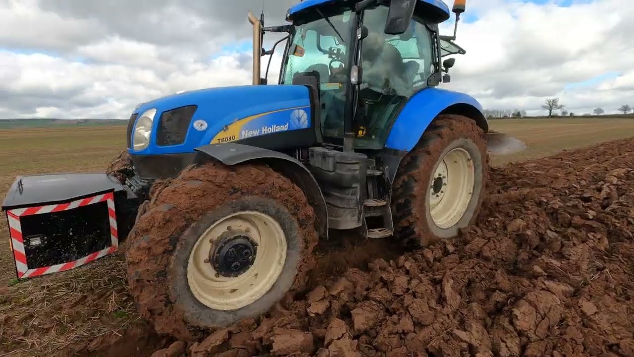 2009 New Holland T6080 6.7 Litre 6-Cyl Diesel Tractor (210 HP) with Dowdeswell Reversible Plough
