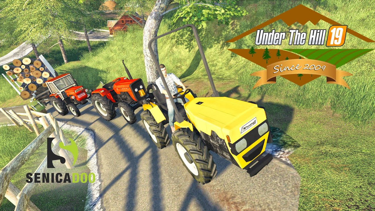 UTH19 - FULL Truck trailer of logs pulled up the hill with small tractors in Slovenia