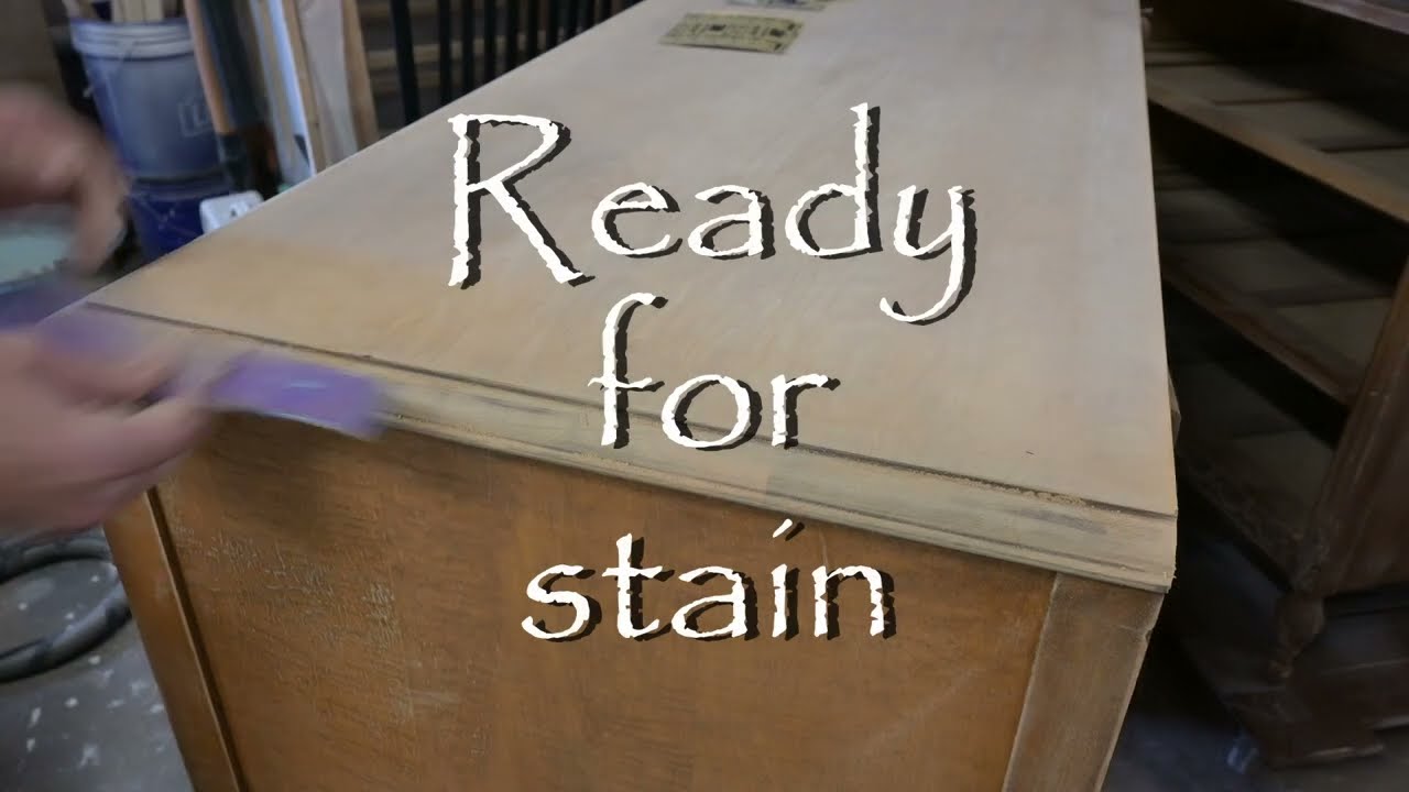 Prepping a dresser top for stain, the bottom is being painted - furniture painting.