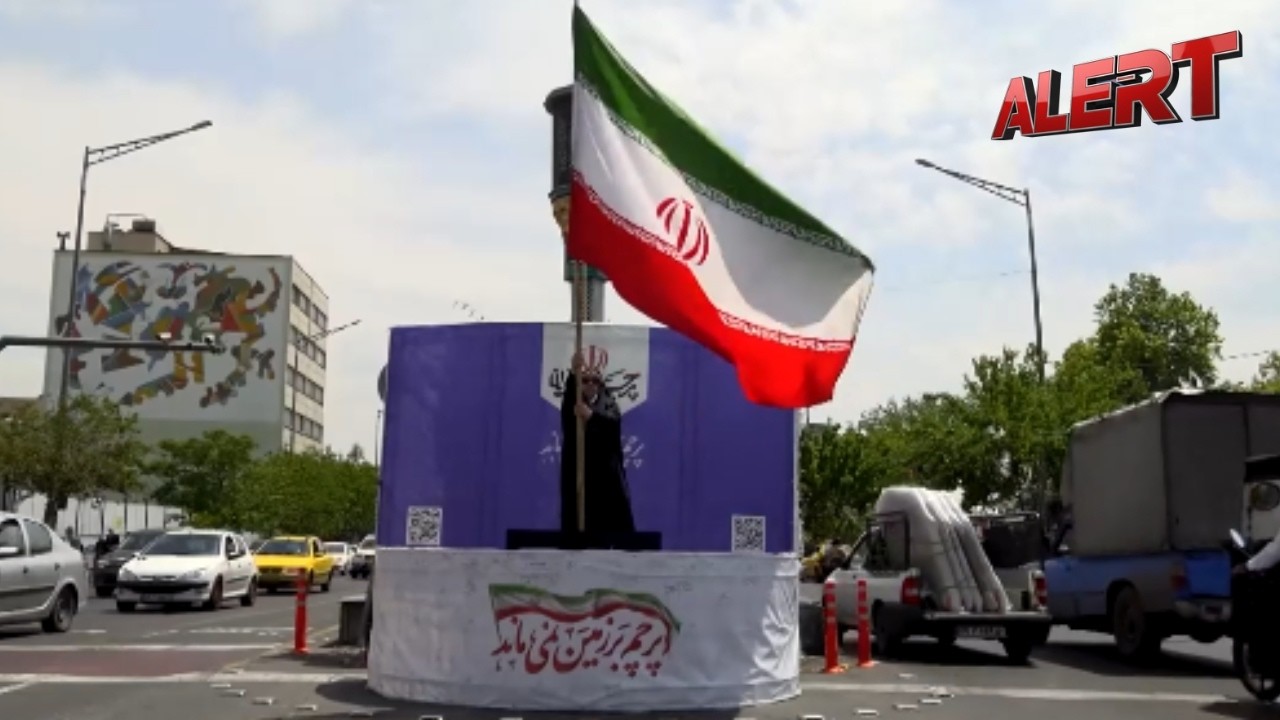 &lsquo;No One Can Bring It Down&rsquo;: Tehran Residents Rally Around Flag In Powerful Protest | ALERT News