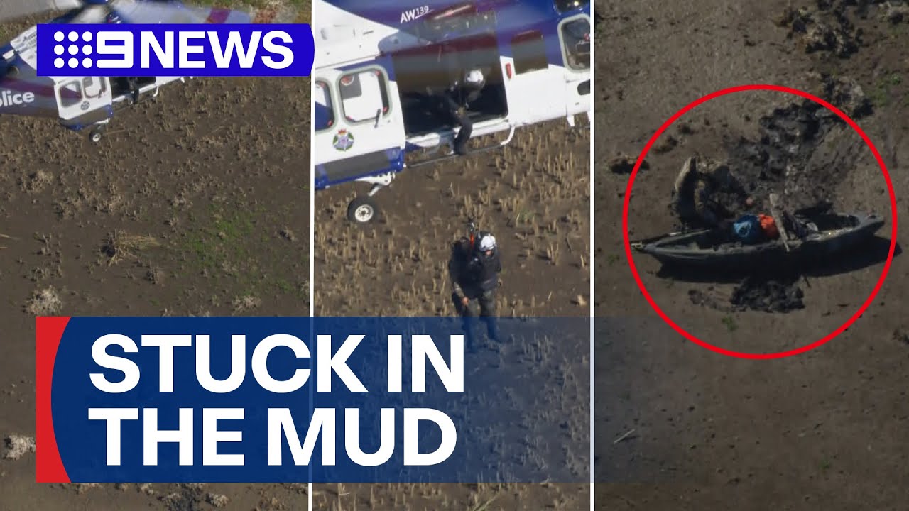 Dramatic moment kayaker is rescued from the mud on Victorian lake | 9 News Australia