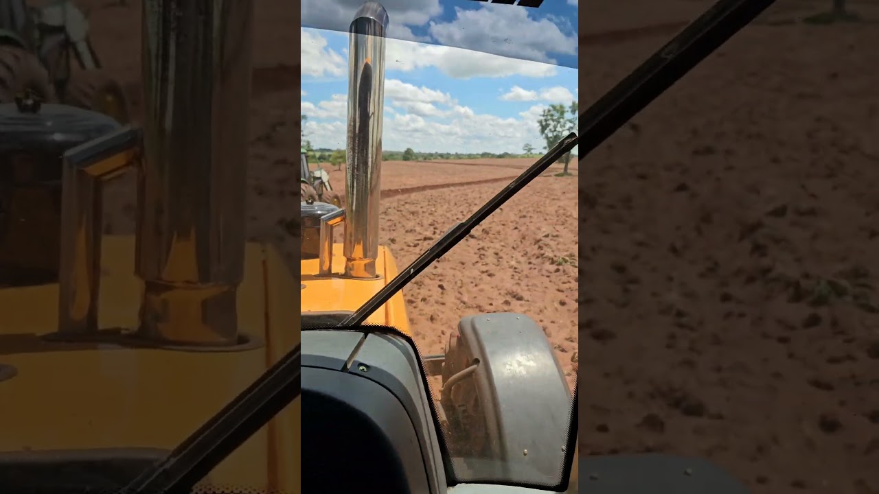 bh 145 + john deere 6125j  na niveladora