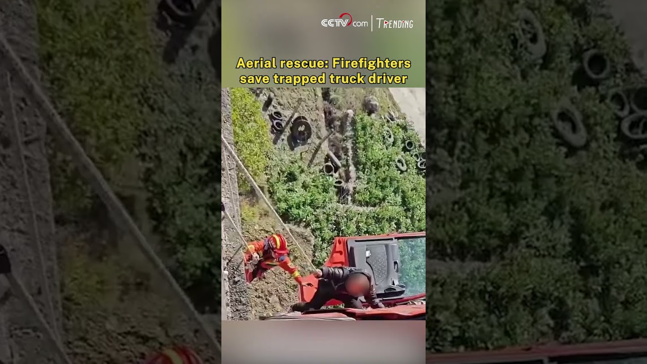 Aerial rescue: Firefighters save trapped truck driver