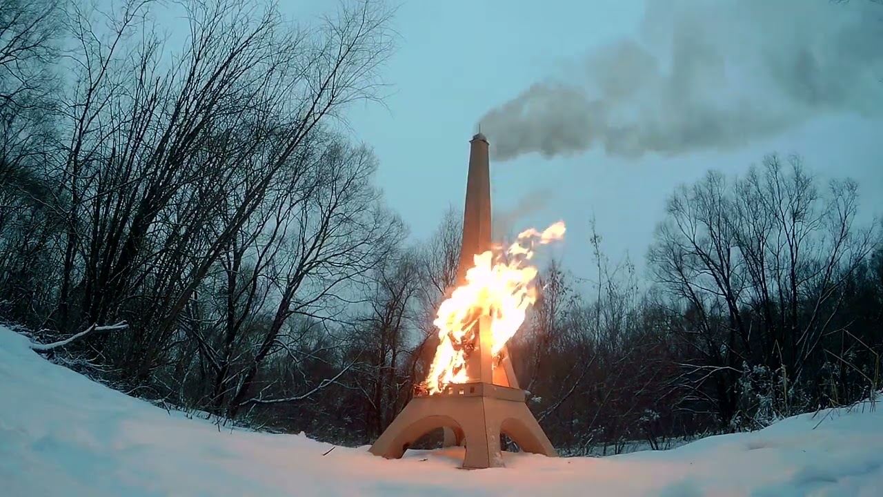 Cardboard Eiffel Tower on fire. Camera 2