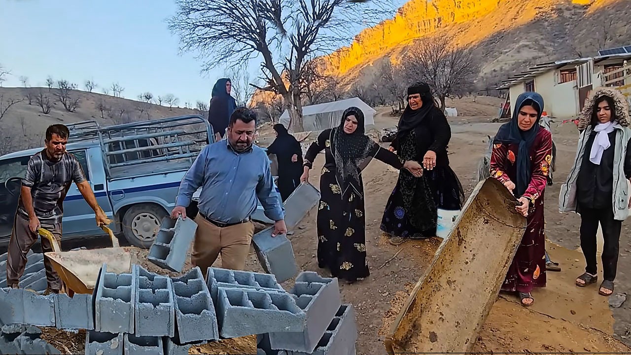 Fariba helps DOORA family organize the farm