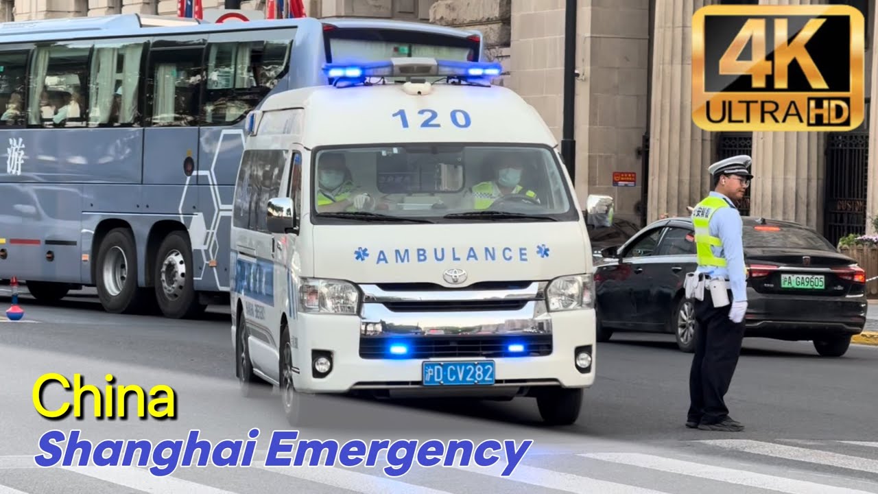 [China]Shanghai Emergency Toyota HIACE ambulance drives against traffic in the crowded Bund