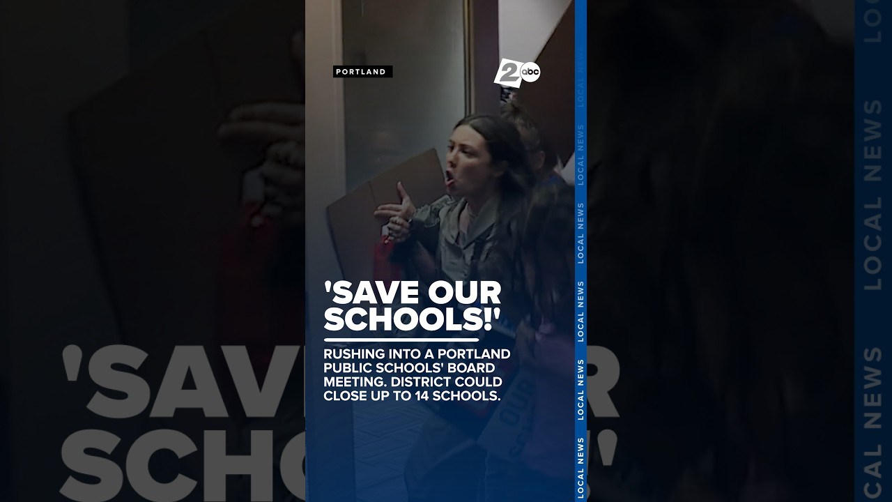 People rush into a Portland Public Schools board meeting shouting, 'Save our schools!'