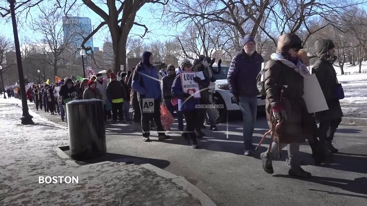 Hundreds march in Boston, chant 