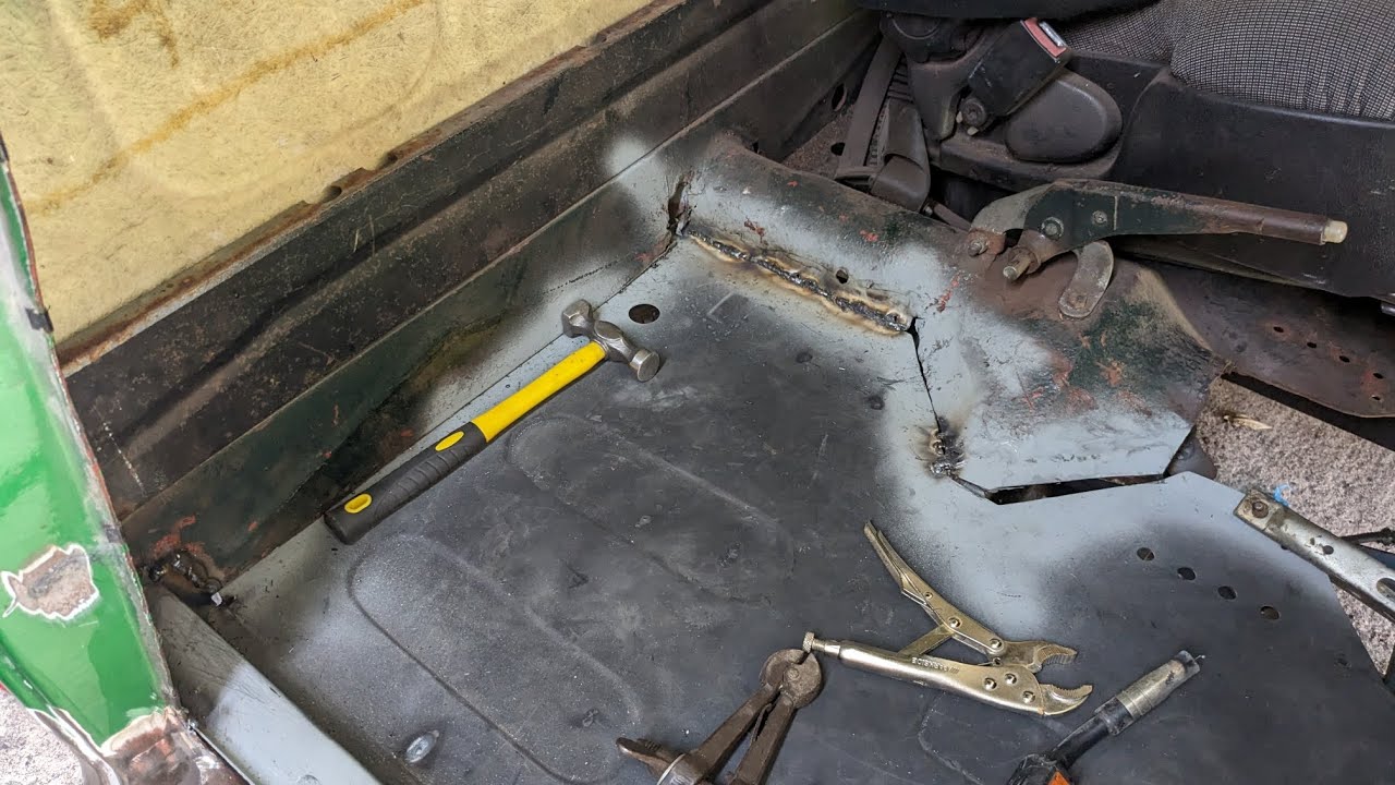 E45- Welding the floor pan in place.