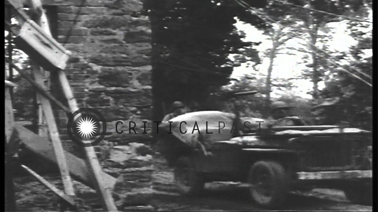 US 4th Division, 8th Infantry, 3rd Battalion soldiers advance towards a German-oc...HD Stock Footage