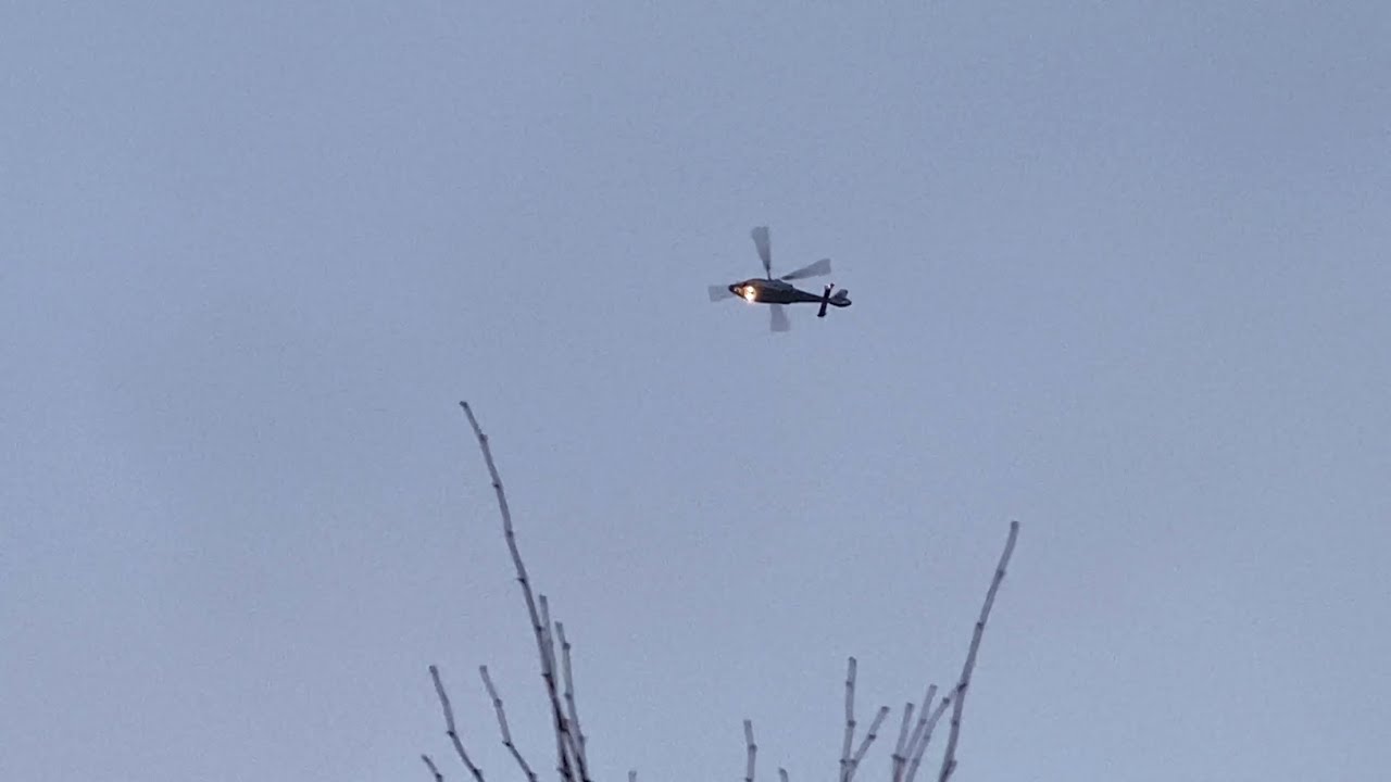 Private AS365 Dauphin [EI-GJL] flying overhead at evening