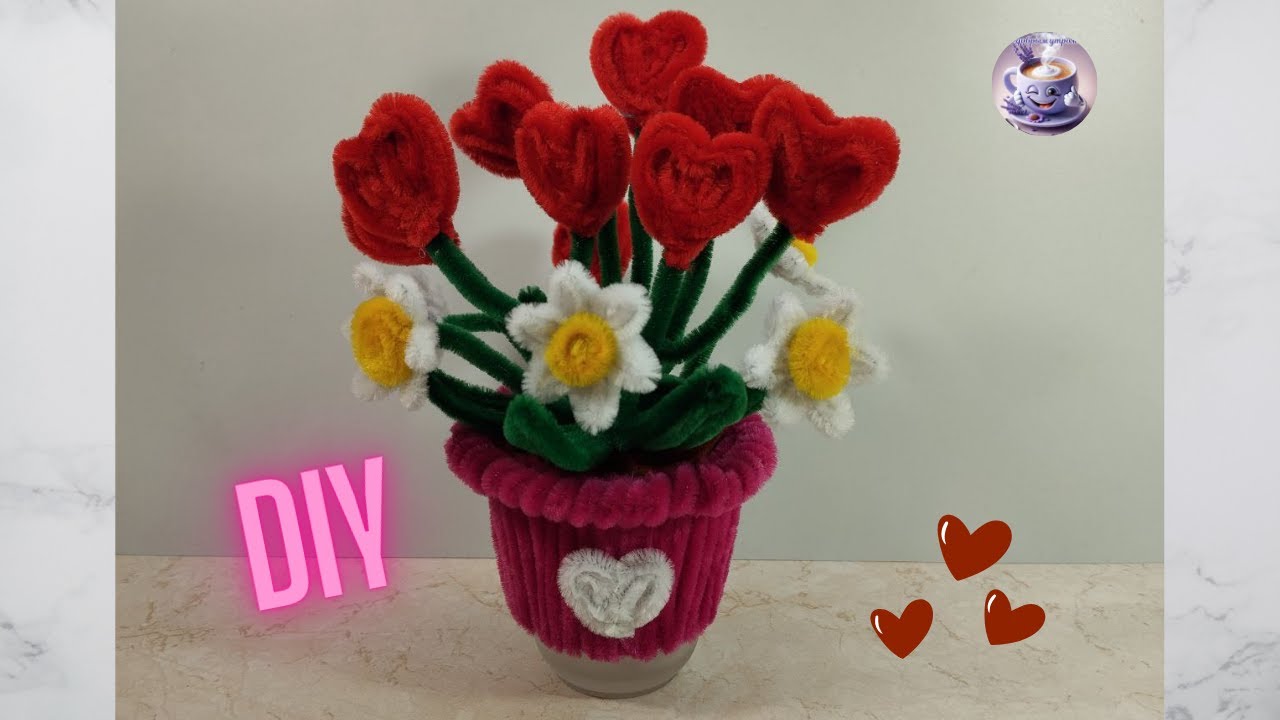 A miniature Valentine's Day arrangement made with hearts and flowers made from chenille wire