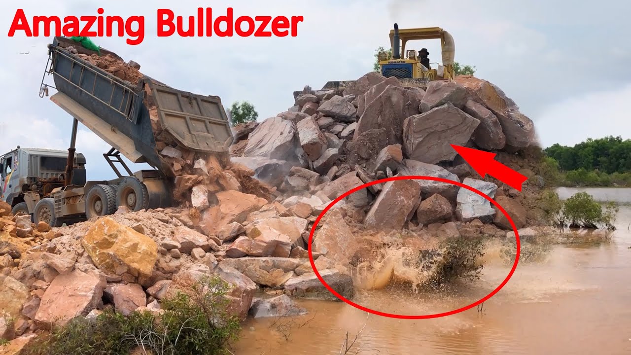 Filling up land huge, Excellent Strong Bulldozer Move Big Rock Stone into water, Dump Truck