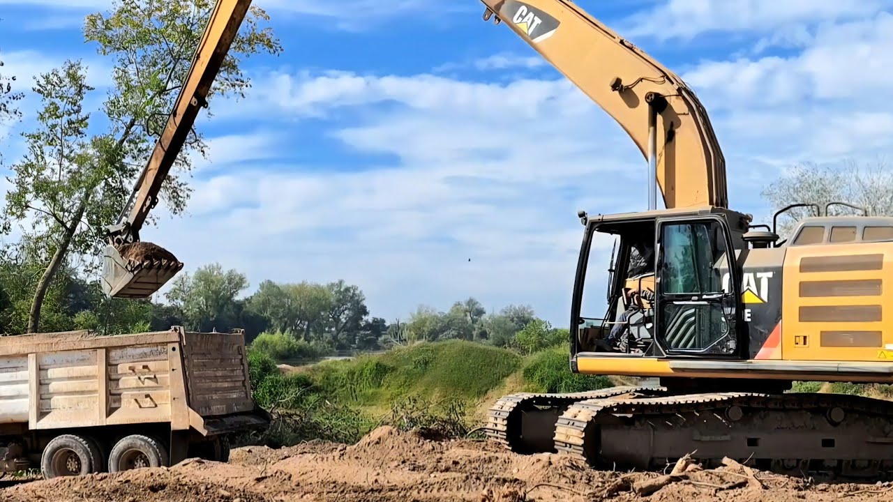 CAT Long Reach Excavator Loads Dump Truck