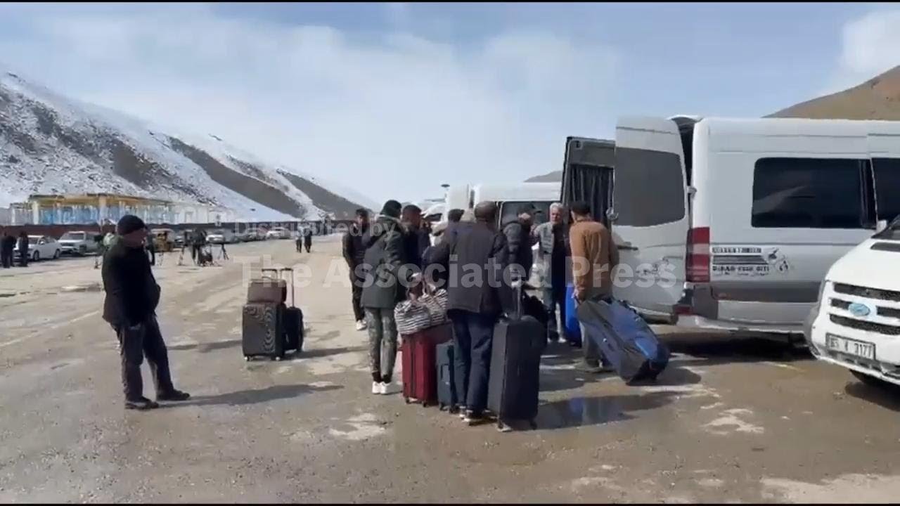 Iranians file across border with Turkey as war escalates, but they say they plan to go back