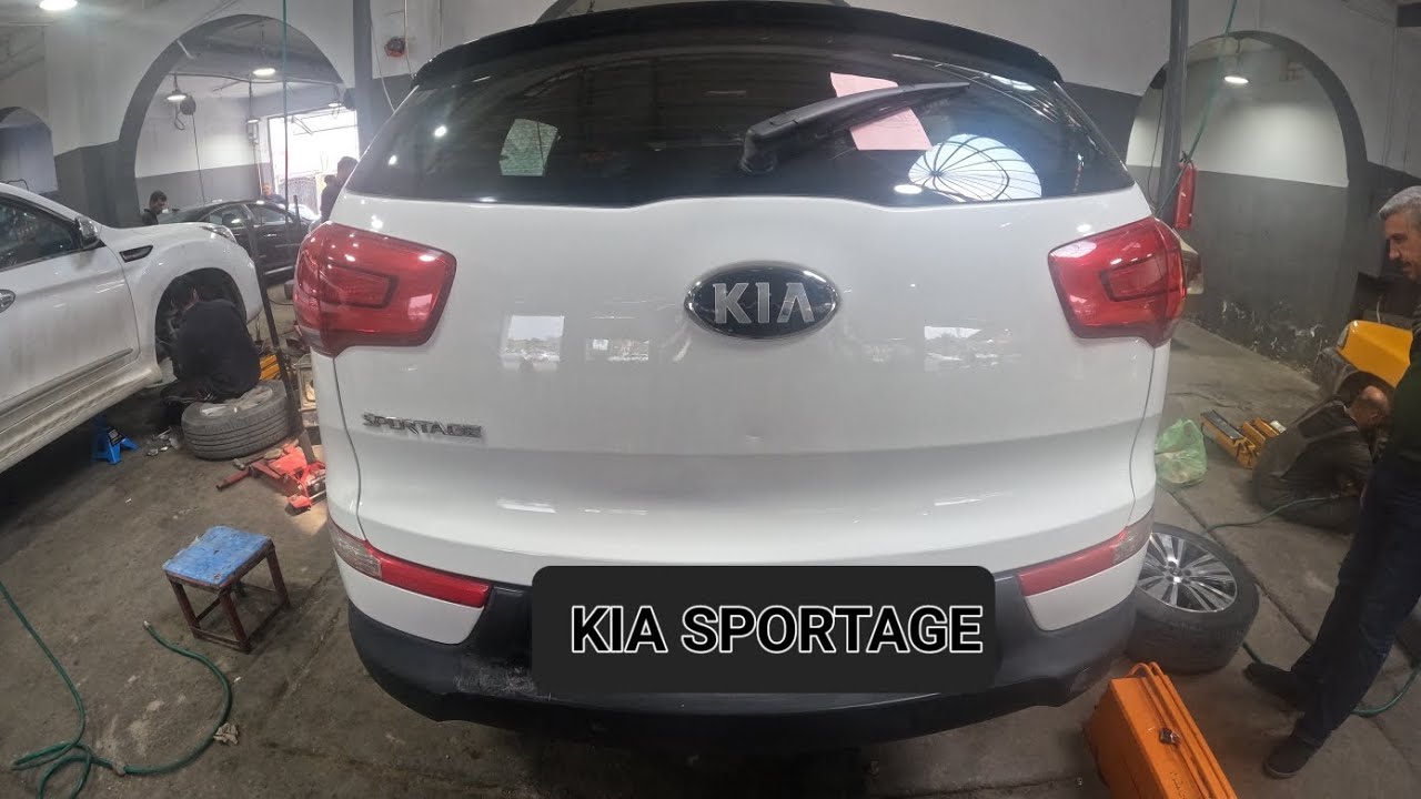 substituindo a bucha do braço de controle inferior traseiro ... kia sportage 2013