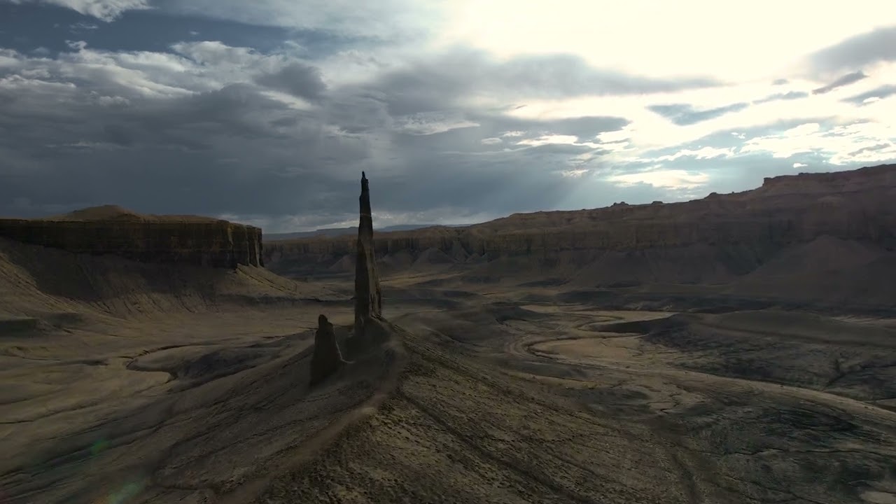 Drone footage of Factory Butte and Lonely Spire near Hanksville, Utah