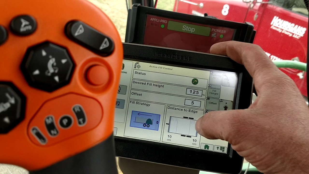 Active fill spout control camera on John Deere 8700 chopper