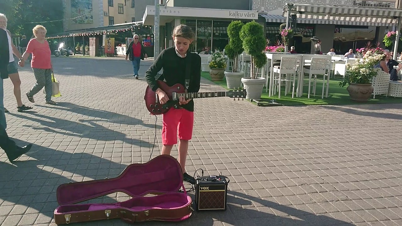 Young Busker playing Gary Moore Parisian Walkways
